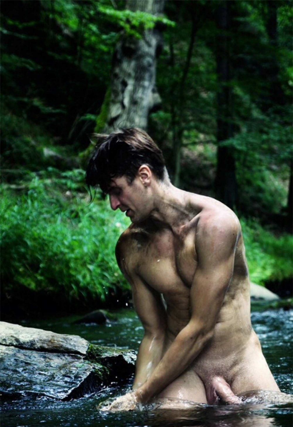 nude man in river bath